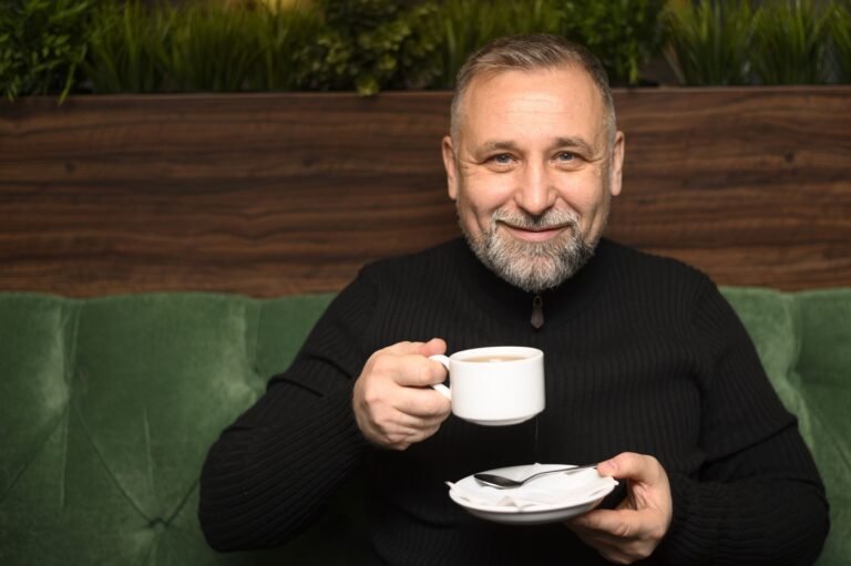 Home man holding cup coffee restaurant